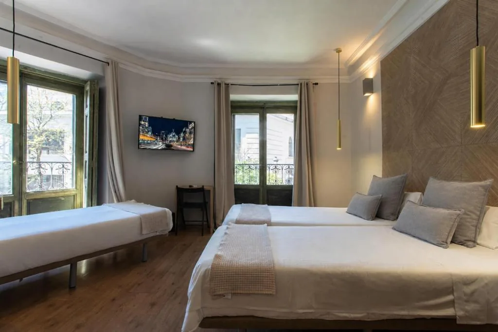 Triple Room with Shared Bathroom and Balcony — AbraCadabra Suites