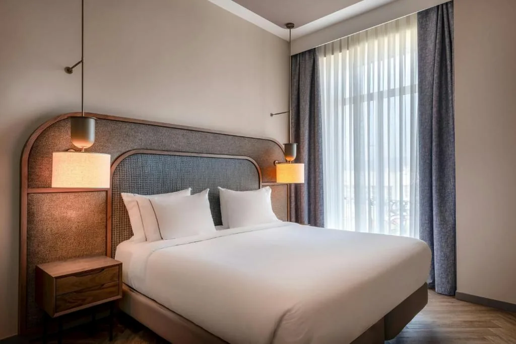 Room with Extra-Large Bed and Sea View — AC Hotel Palacio Universal by Marriott