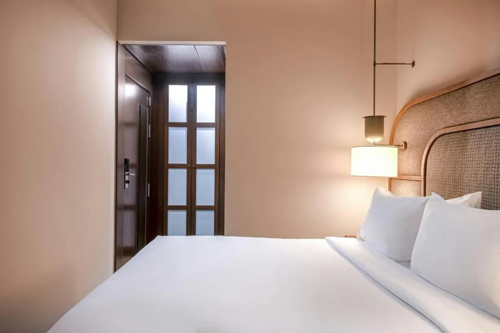 Interior Room with Large Bed — AC Hotel Palacio Universal by Marriott