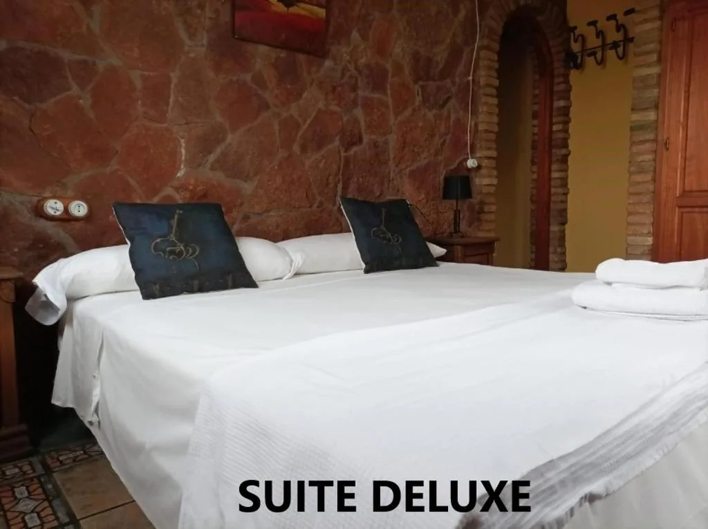 Suite Deluxe con vasca idromassaggio — Alojamientos La Casa de Piedra