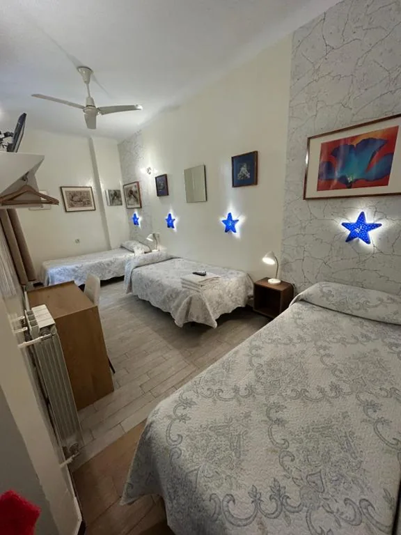 Habitación Doble con cama supletoria - 2 camas — Casa de Huespedes Dolce Vita
