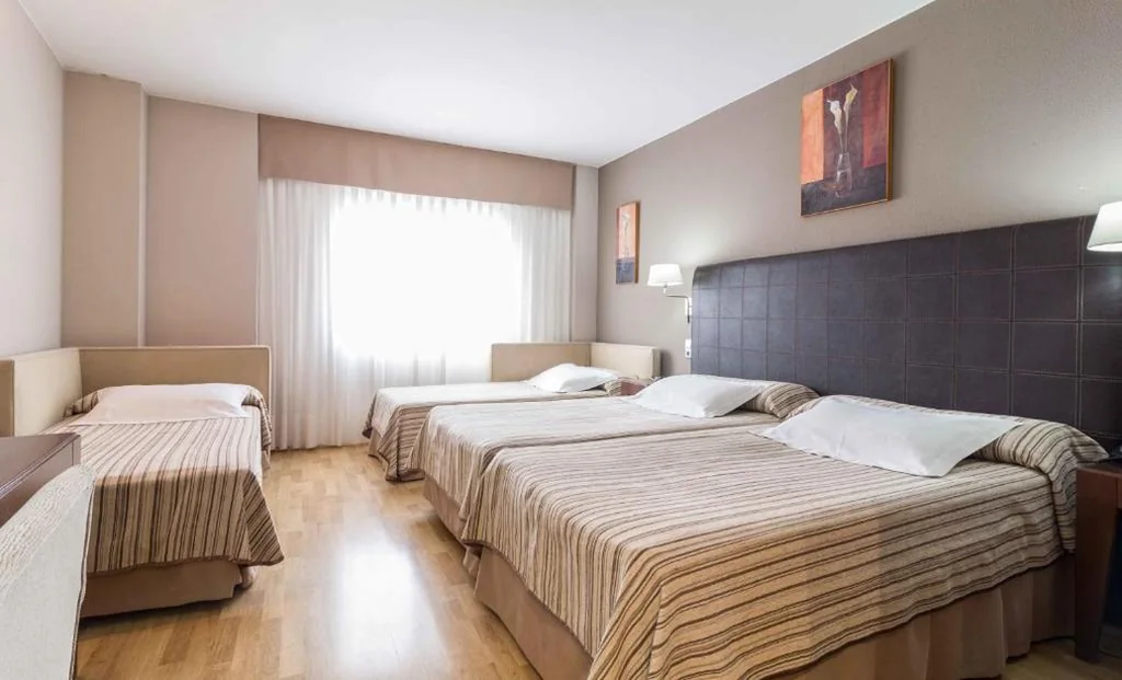 Habitación Triple — El Patio