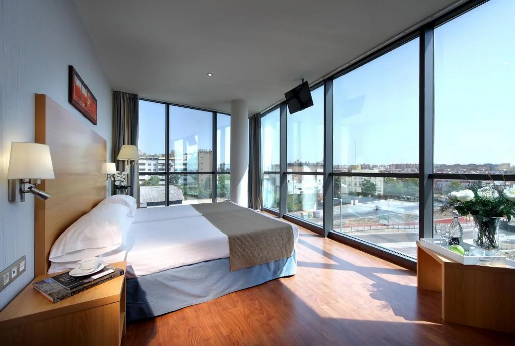 Habitación cuádruple — Exe Sevilla Palmera