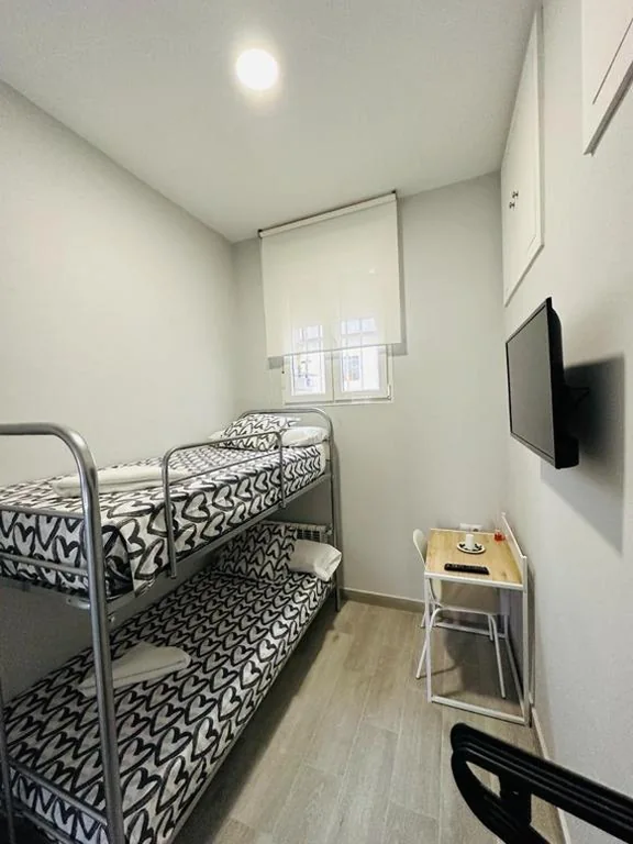Zimmer mit Etagenbetten und Gemeinschaftsbad — HOSPEDAJE CUATRO VIENTOS