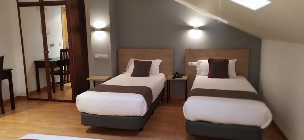 Quarto Quádruplo — Hospedium Hotel Vittoria Colonna