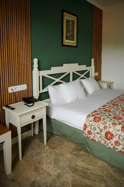 Familiekamer met uitzicht op de tuin — Hospedium Nuevo Hotel Parque Cabaneros