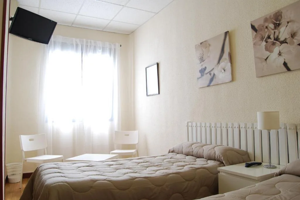 Habitación cuádruple — Hostal America