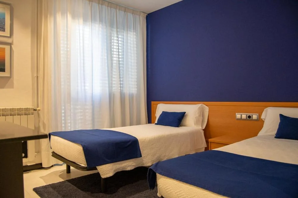 Camera matrimoniale con letti singoli — Hostal Apolo