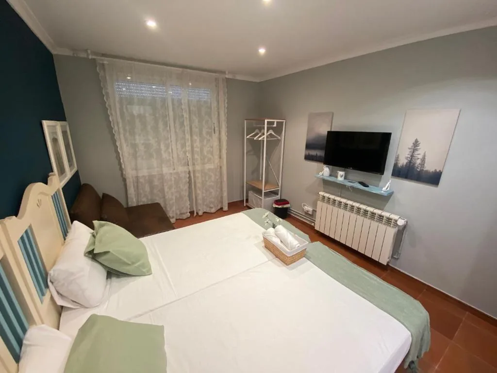 Driepersoonskamer met eigen badkamer — Hostal Casa San Nicolas