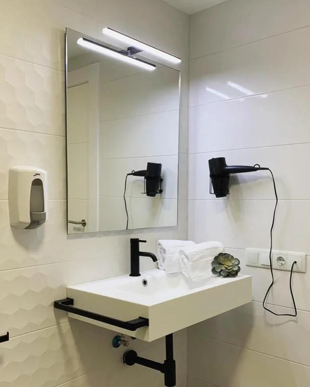 Quarto Triplo — Hostal Comfort Suites