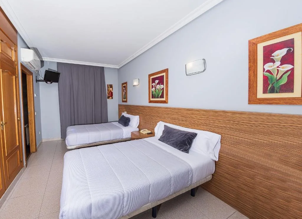 Quarto Duplo com serviço gratuito de transporte para o aeroporto - 2 camas — Hostal El Cruce