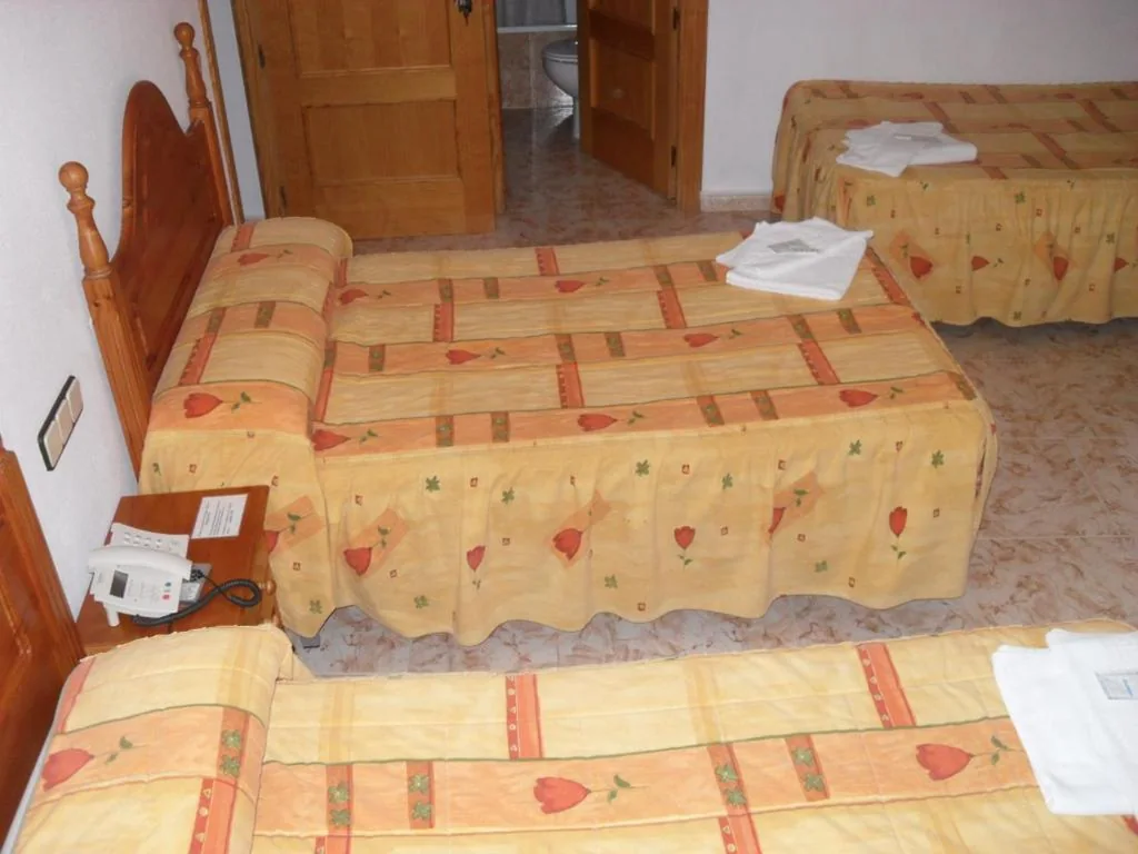 Quarto Triplo — Hostal La Paz