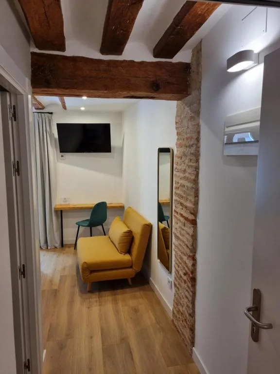 Chambre double Deluxe avec lit d’appoint — Hostal La Rúa
