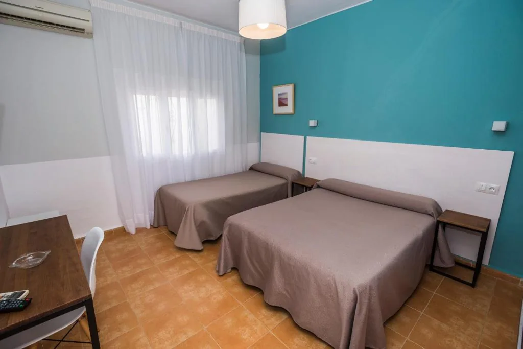 Habitación Triple — Hostal Las Cumbres