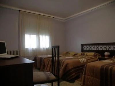 Habitación Triple — Hostal Oasis