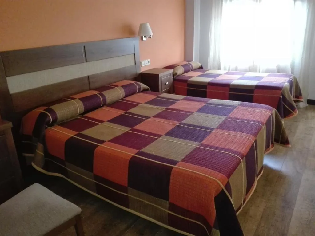 Habitación Cuádruple Confort — Hostal Patrón