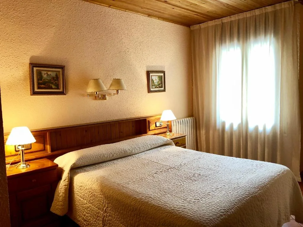 Budget Quadruple Room — Hostal Pey
