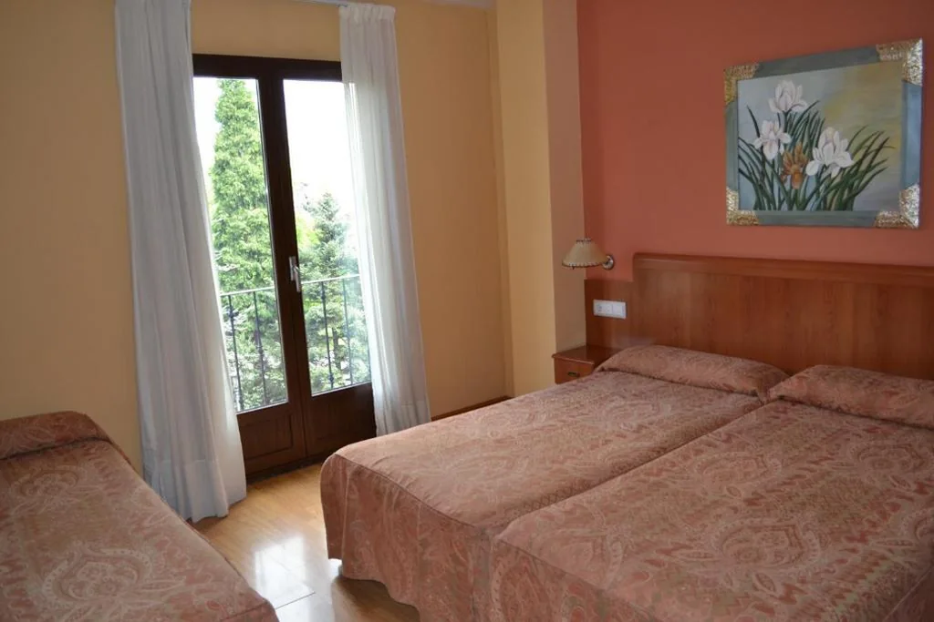 Camera tripla con balcone — Hostal Quevedo