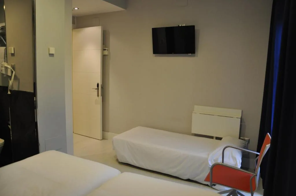 Habitación Triple — Hosteria Santander