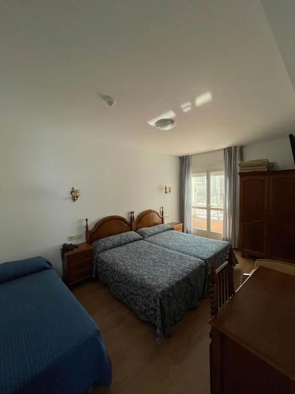 Camera doppia con letto supplementare — Hotel Amandi