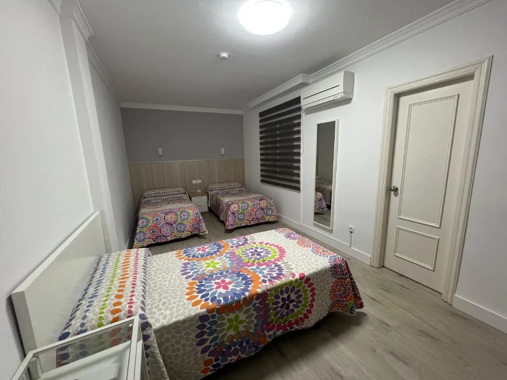 Habitación Triple — Hotel Dila
