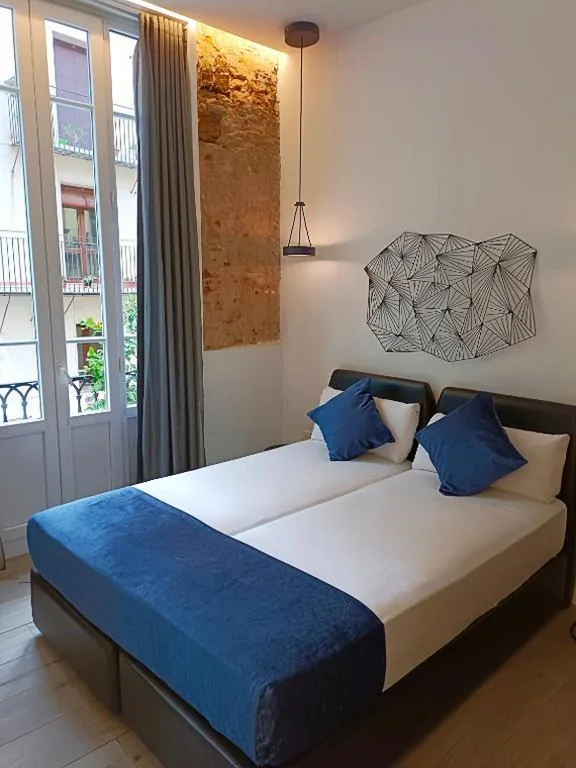 Standaard tweepersoonskamer aan de buitenzijde - 2 bedden — Hotel El Siglo