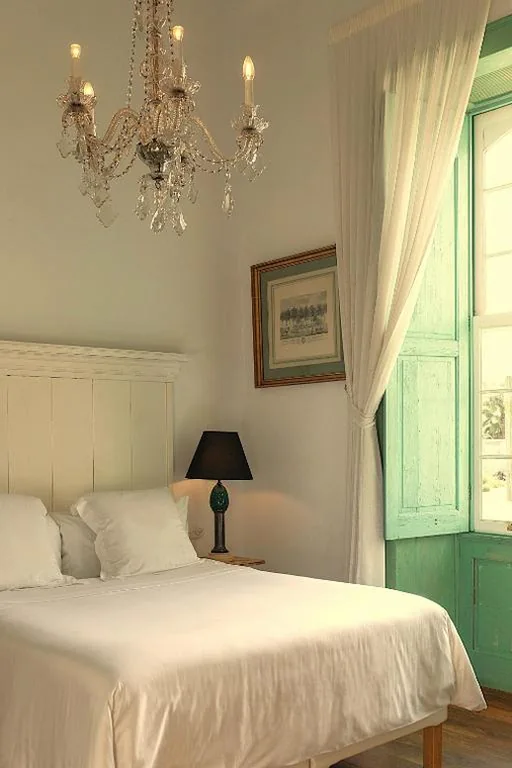 Superior Quadruple Room — Hotel Emblemático La Casa de los Naranjos