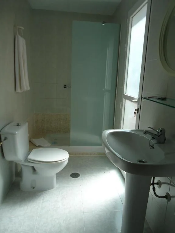 Quarto Triplo — Hotel Madrid