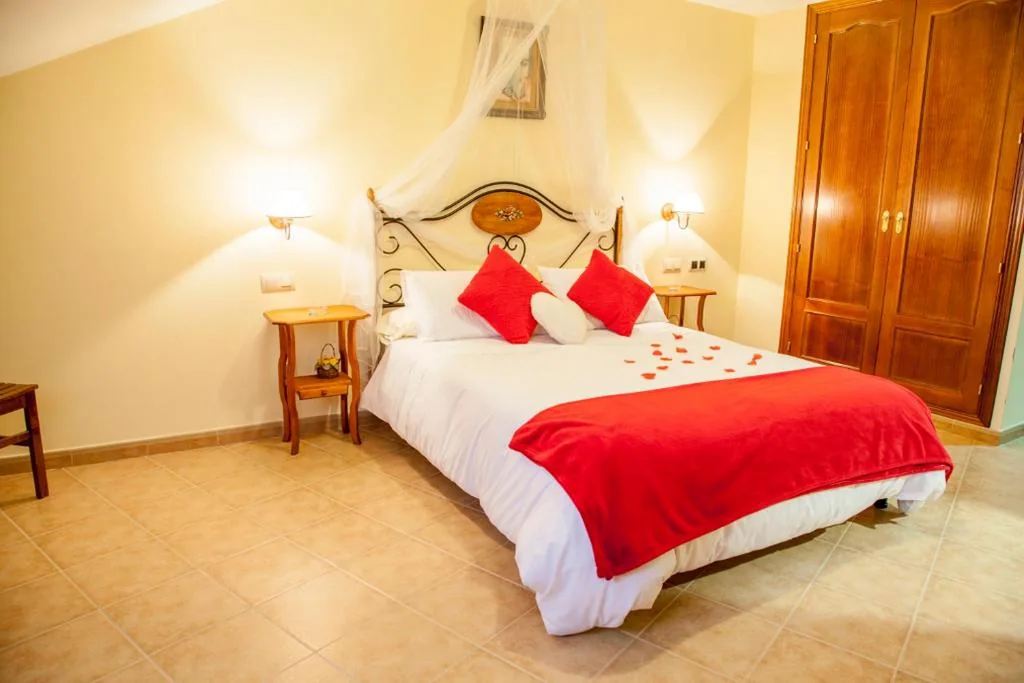 Suite Deluxe con bañera de hidromasaje — Hotel Mayno