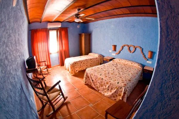 Triple Room with Pool View — Hotel Rural El Cortijo