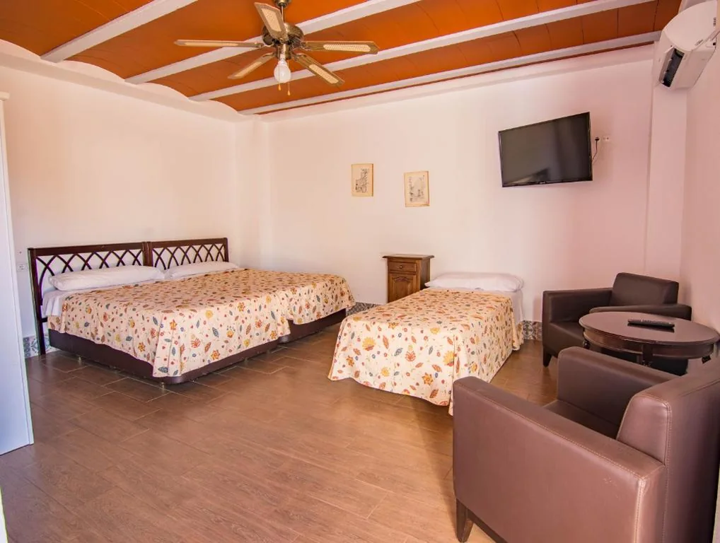 Triple Room with Garden View — Hotel Rural El Cortijo