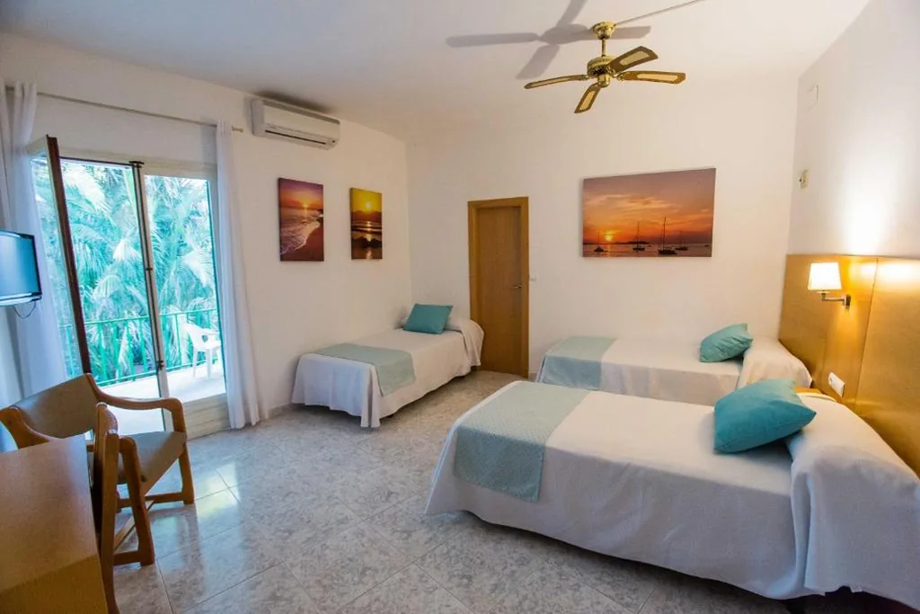 Quarto triplo com varanda — Hotel Tagomago