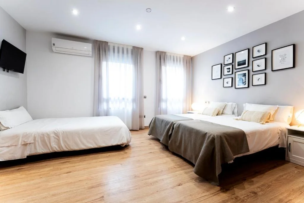Camera tripla Deluxe — Infinium Zamora Suites con parking