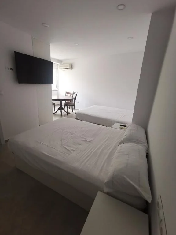 Comfort Quadruple Room — Joya Suites Calle Victoria