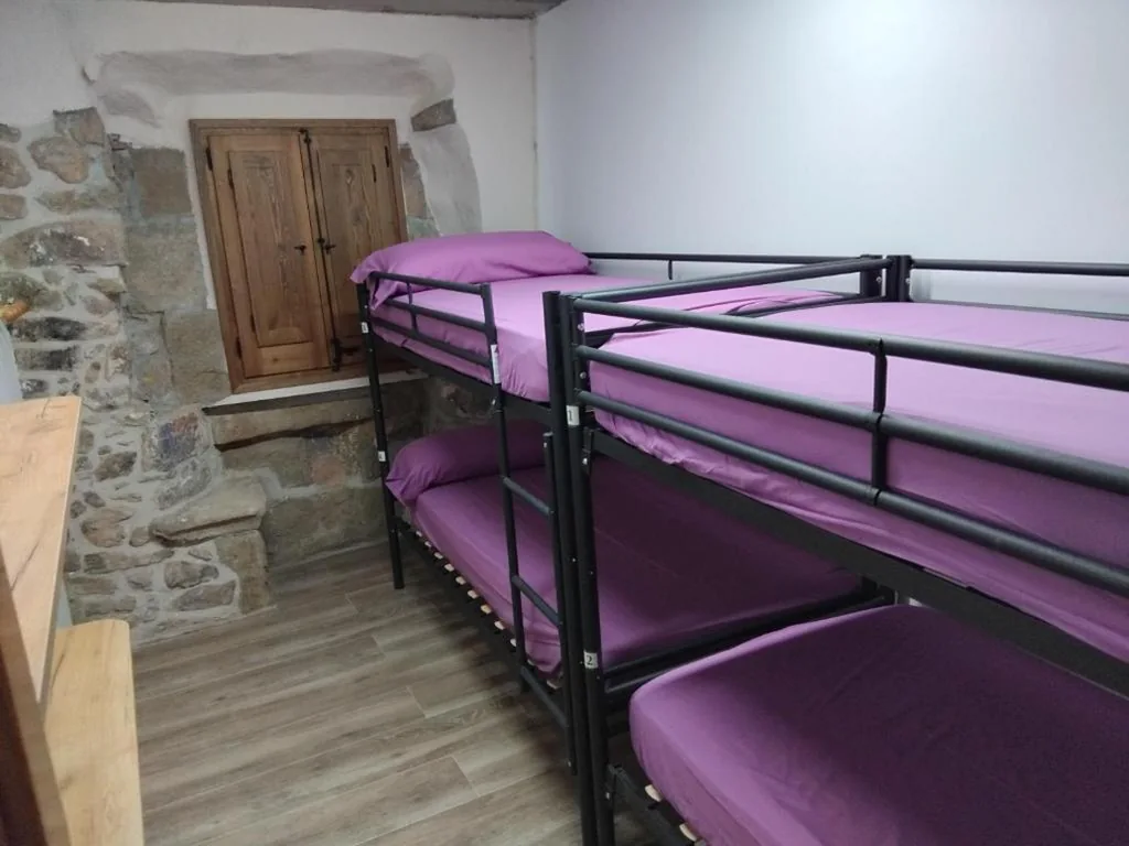 Habitación cuádruple — L'alberg la rectoria de la Torra