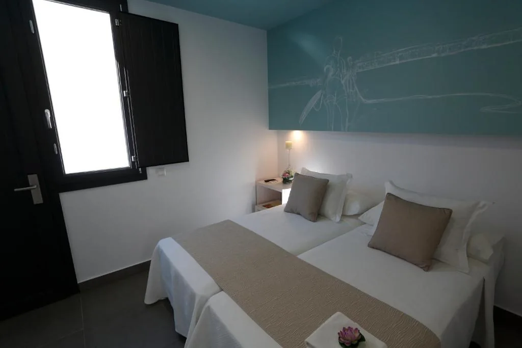 Habitación Doble con cama supletoria - 1 o 2 camas — La Pasajera Hostal Boutique