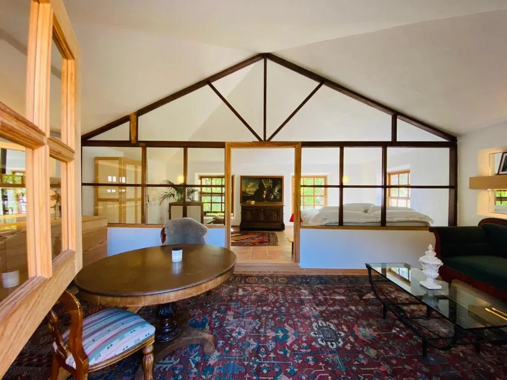 Suite con vistas al jardín — La Rayuela Suites Boutique