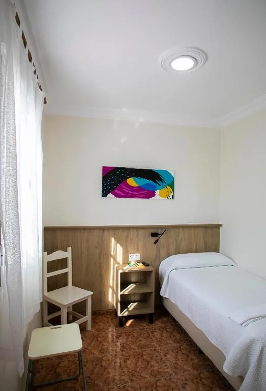 Quarto Individual — Pensión Dulces Sueños