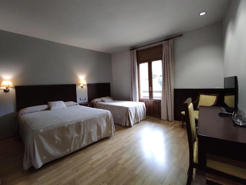 Triple Room with Balcony — SNÖ Hotel Bielsa