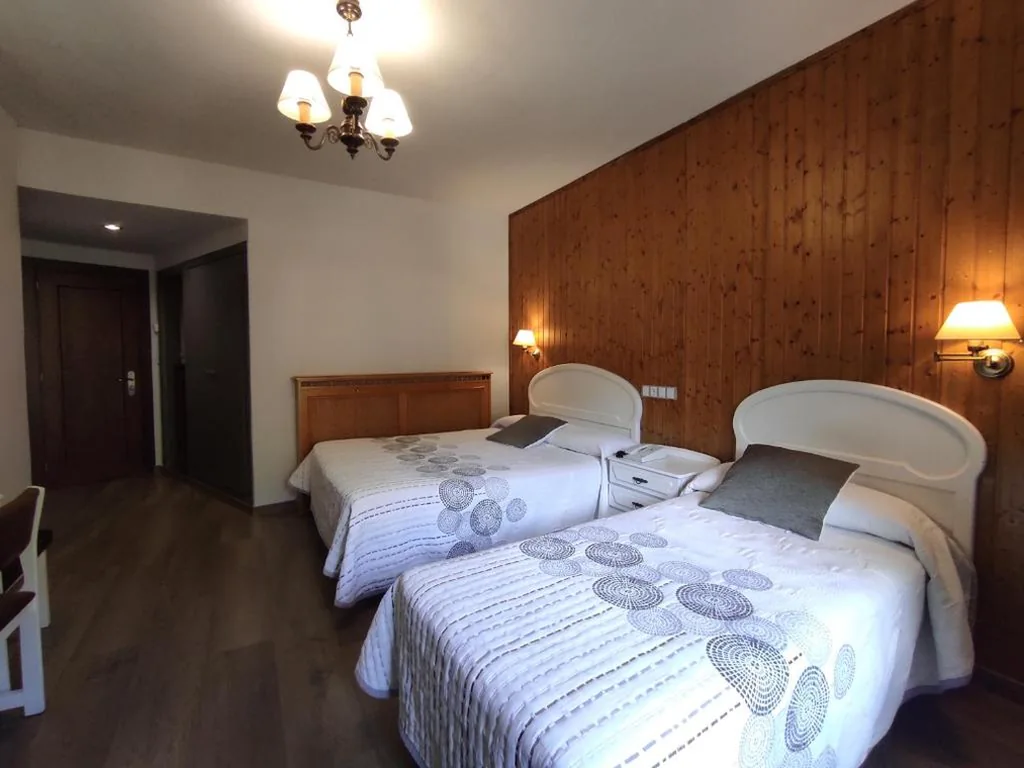 Standard Triple Room with Balcony — SNÖ Hotel Bielsa