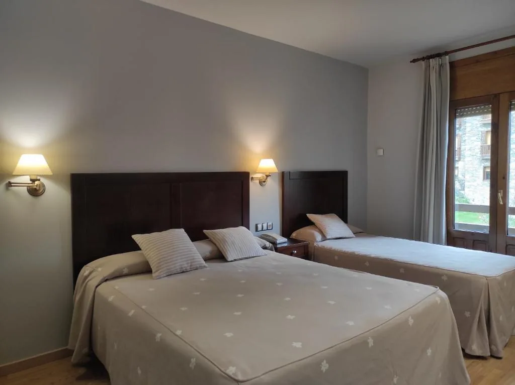Superior Triple Room with Balcony — SNÖ Hotel Bielsa
