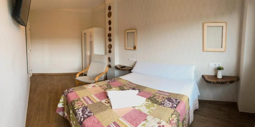 Habitación Triple con vistas al jardín — Villa Galicia