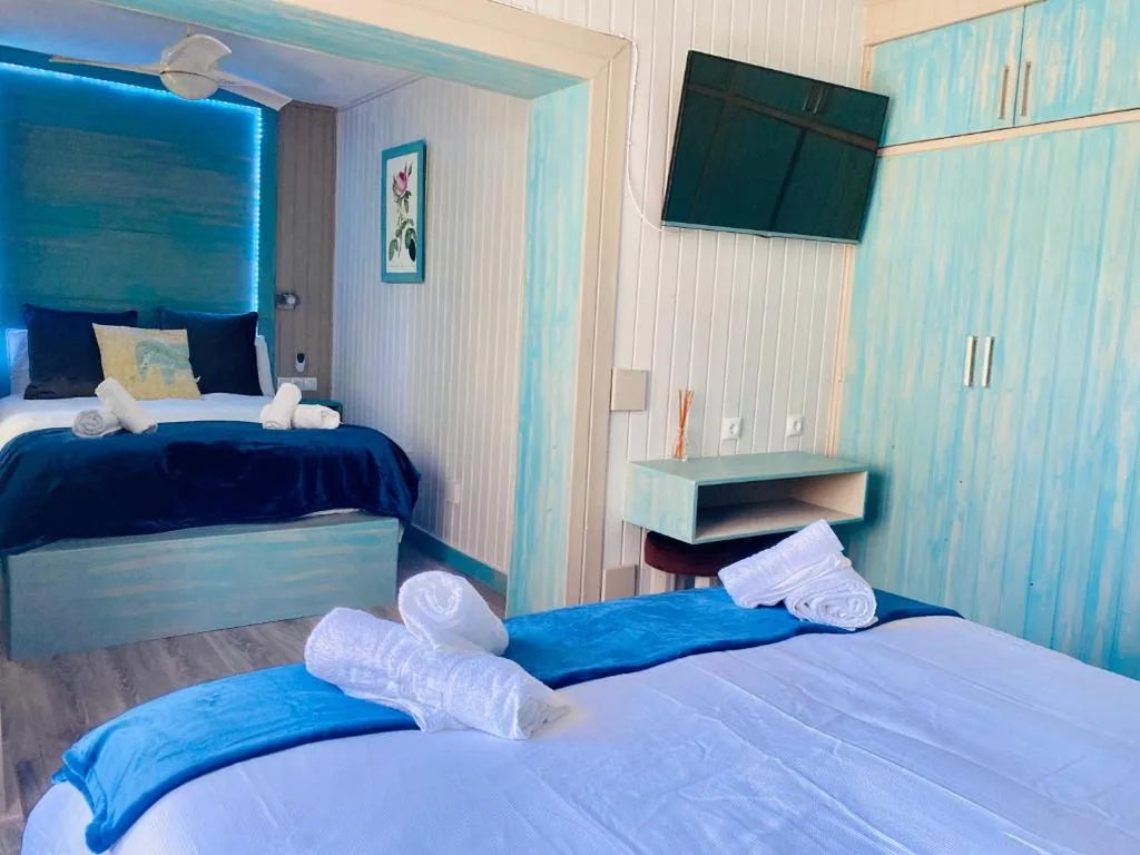 Habitación Cuádruple con baño — Villa Palma
