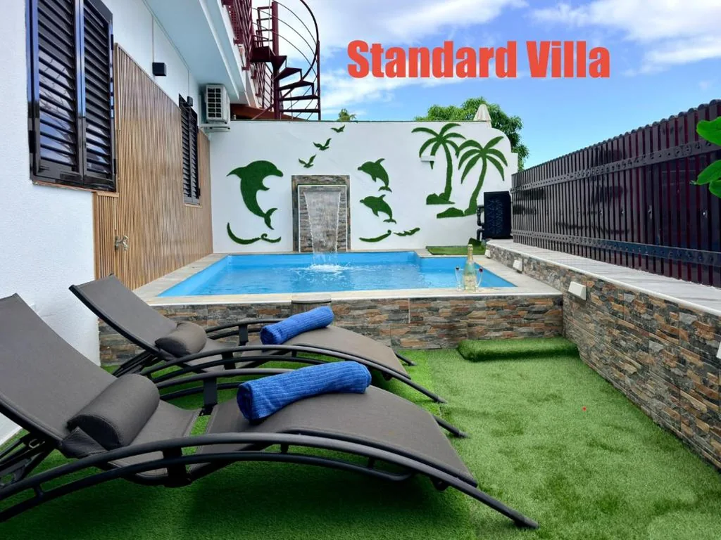 Villa Estándar — Villas Puerto Rico in front of the shopping center with private heated saltwater pool with jacuzzi function & arcade games