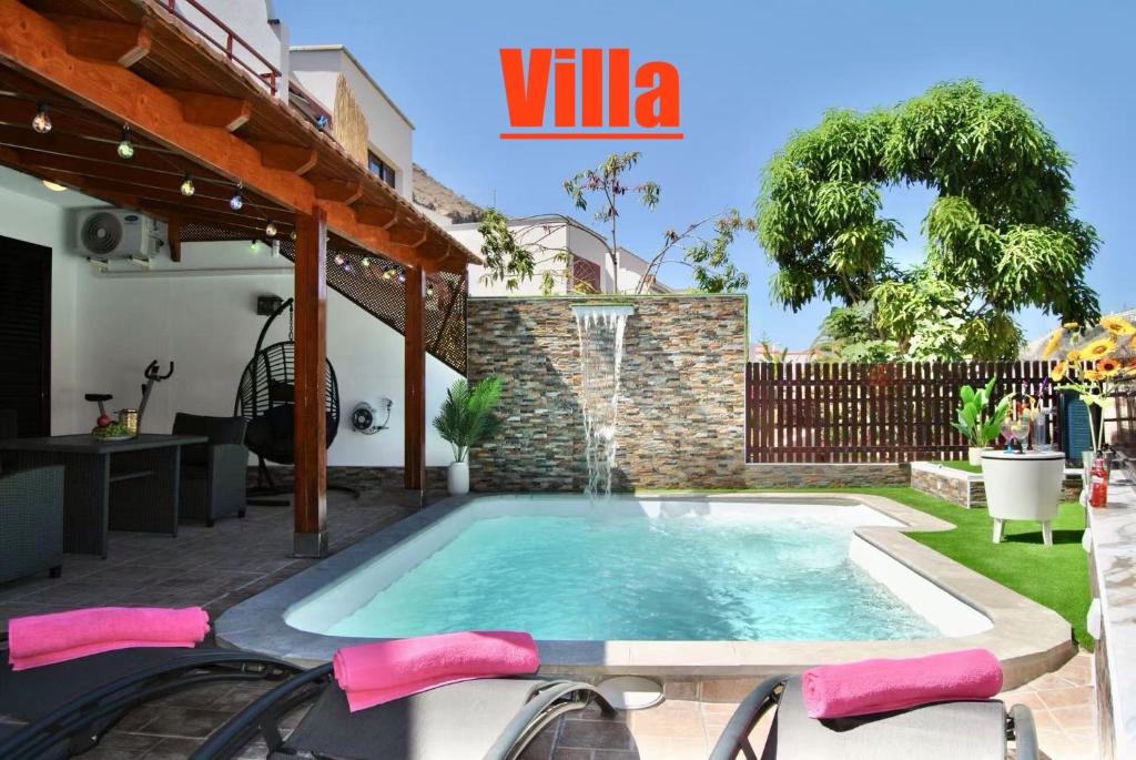Villas Puerto Rico in front of the shopping center with private heated saltwater pool with jacuzzi function & arcade games